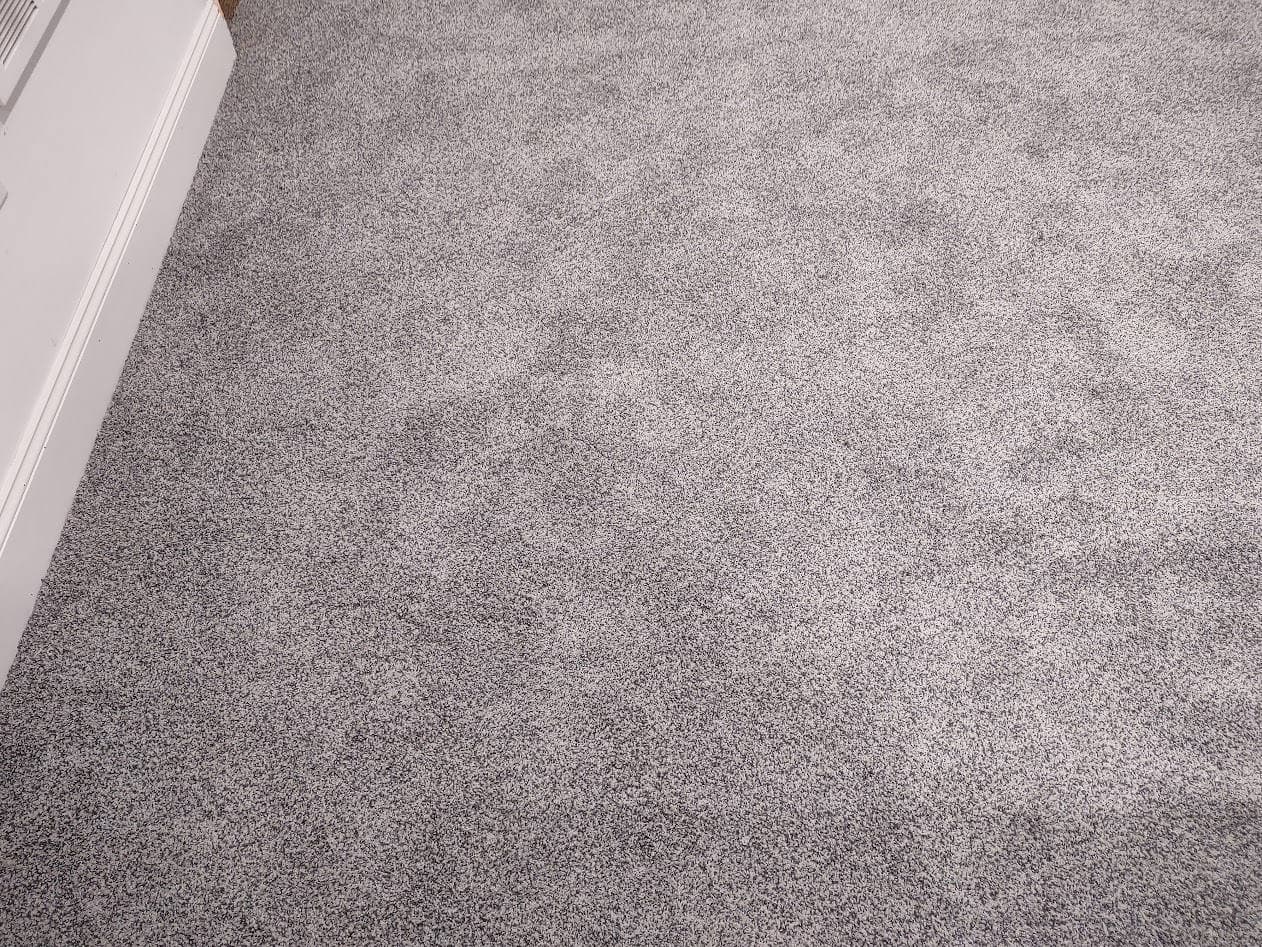 Close-up of the finished carpet where the two pieces were seamed — the seam is not visible