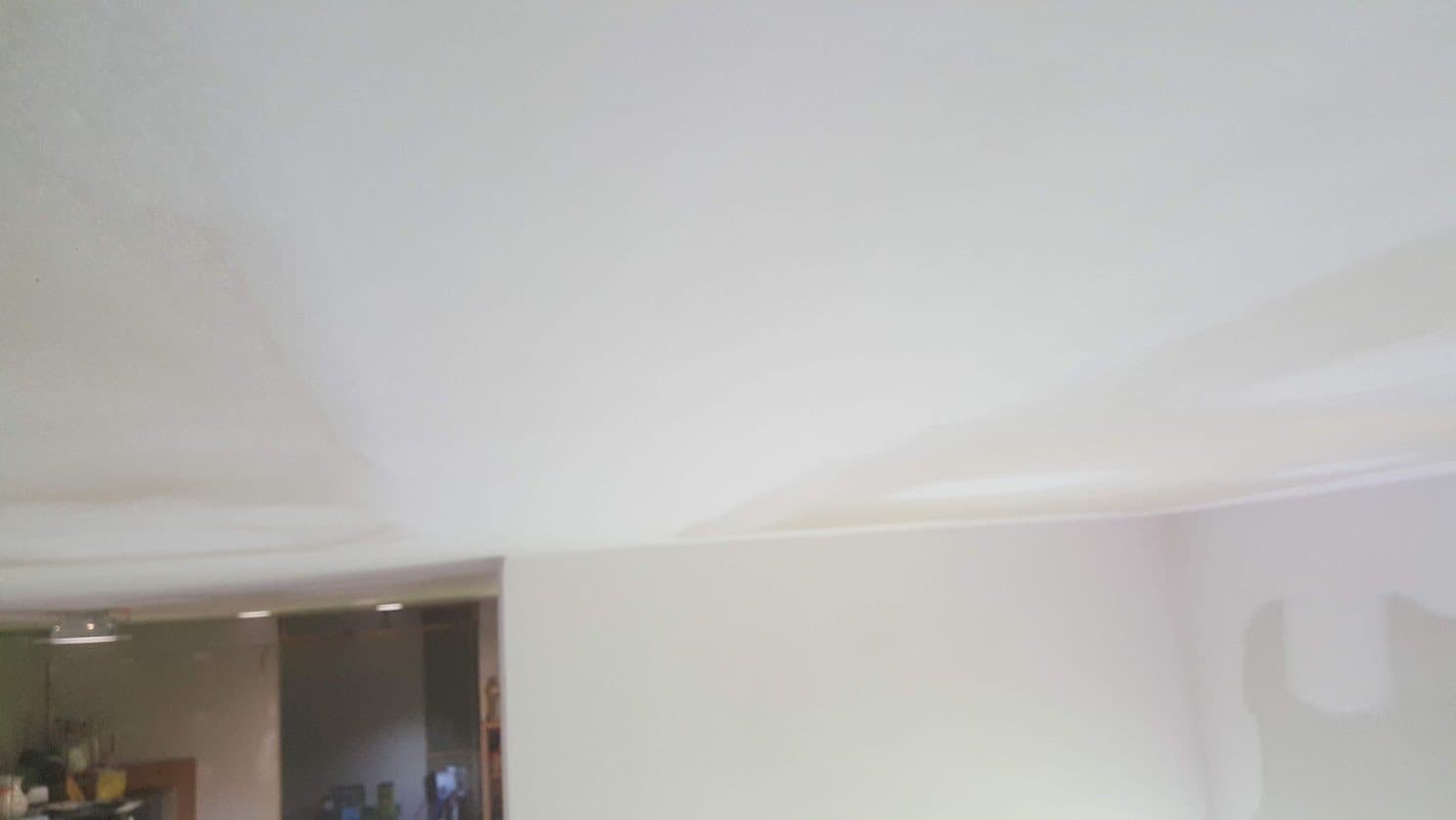 Finished smooth drywall ceiling and inside corner, sanded flat and ready for primer