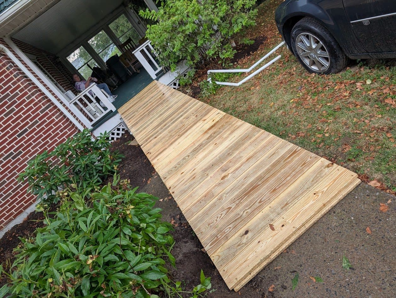 Ramp decking laid in pressure-treated lumber during construction