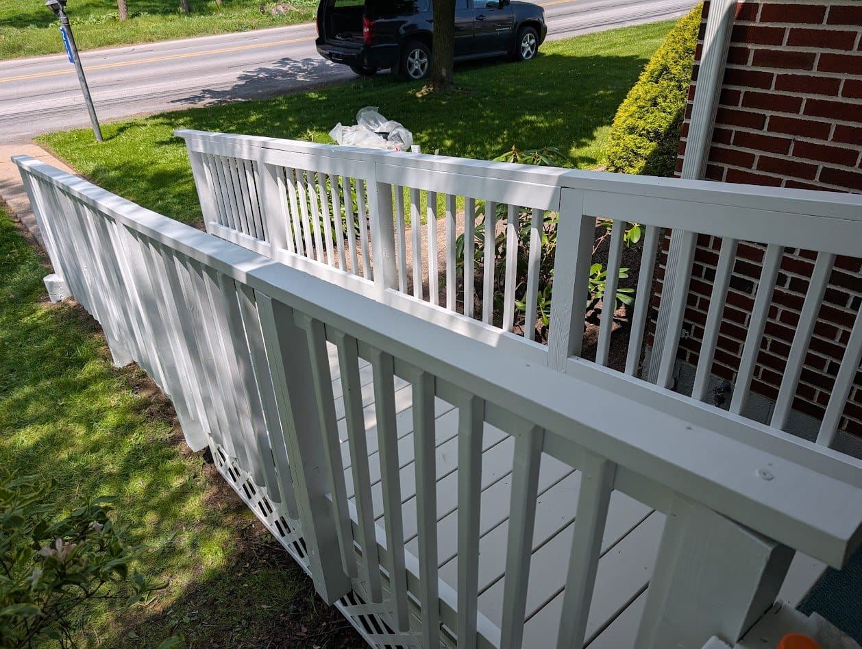 Angled view of the freshly painted ramp and handrails