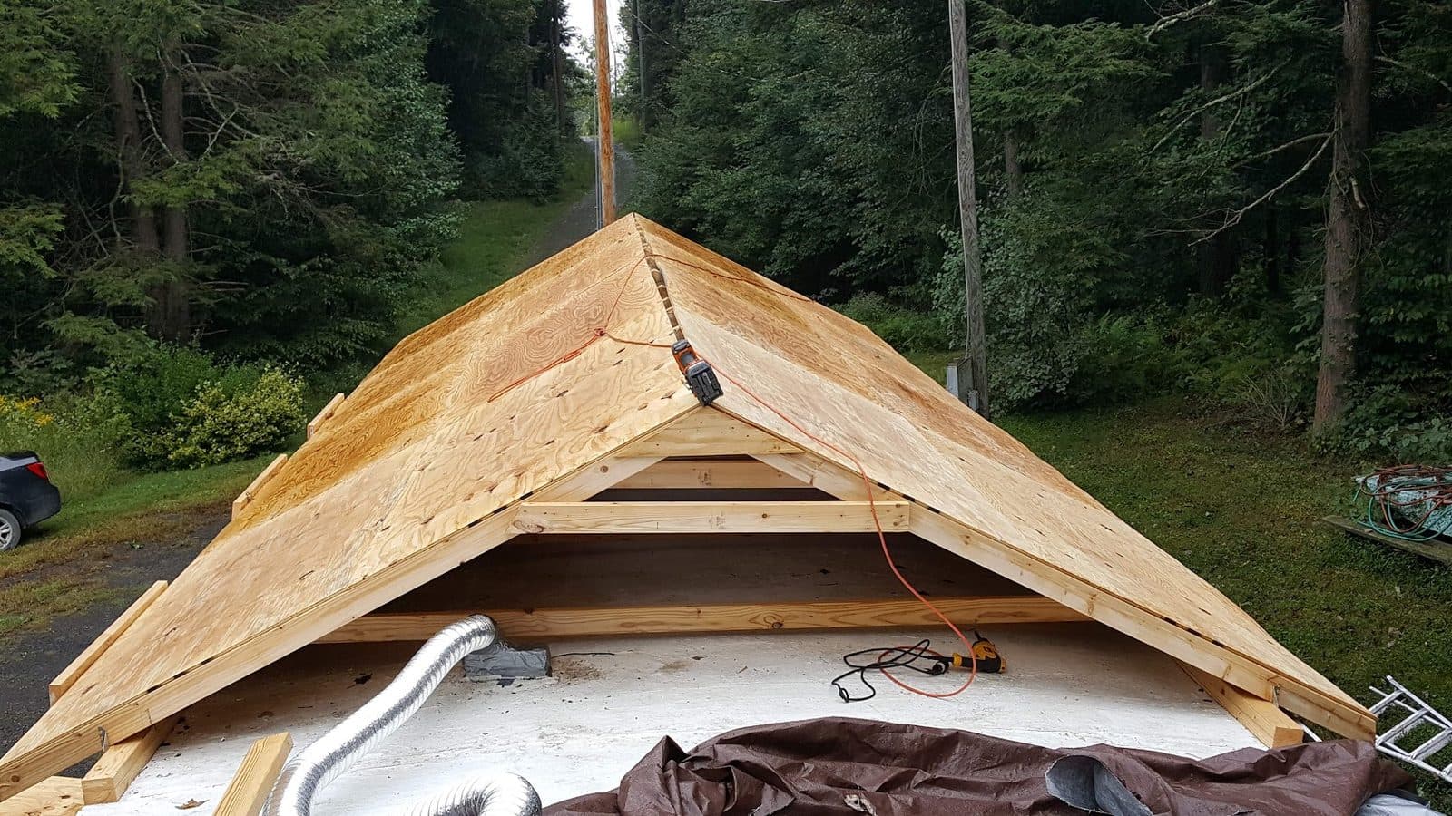 Custom oversized roof trusses framed and sheathed on site