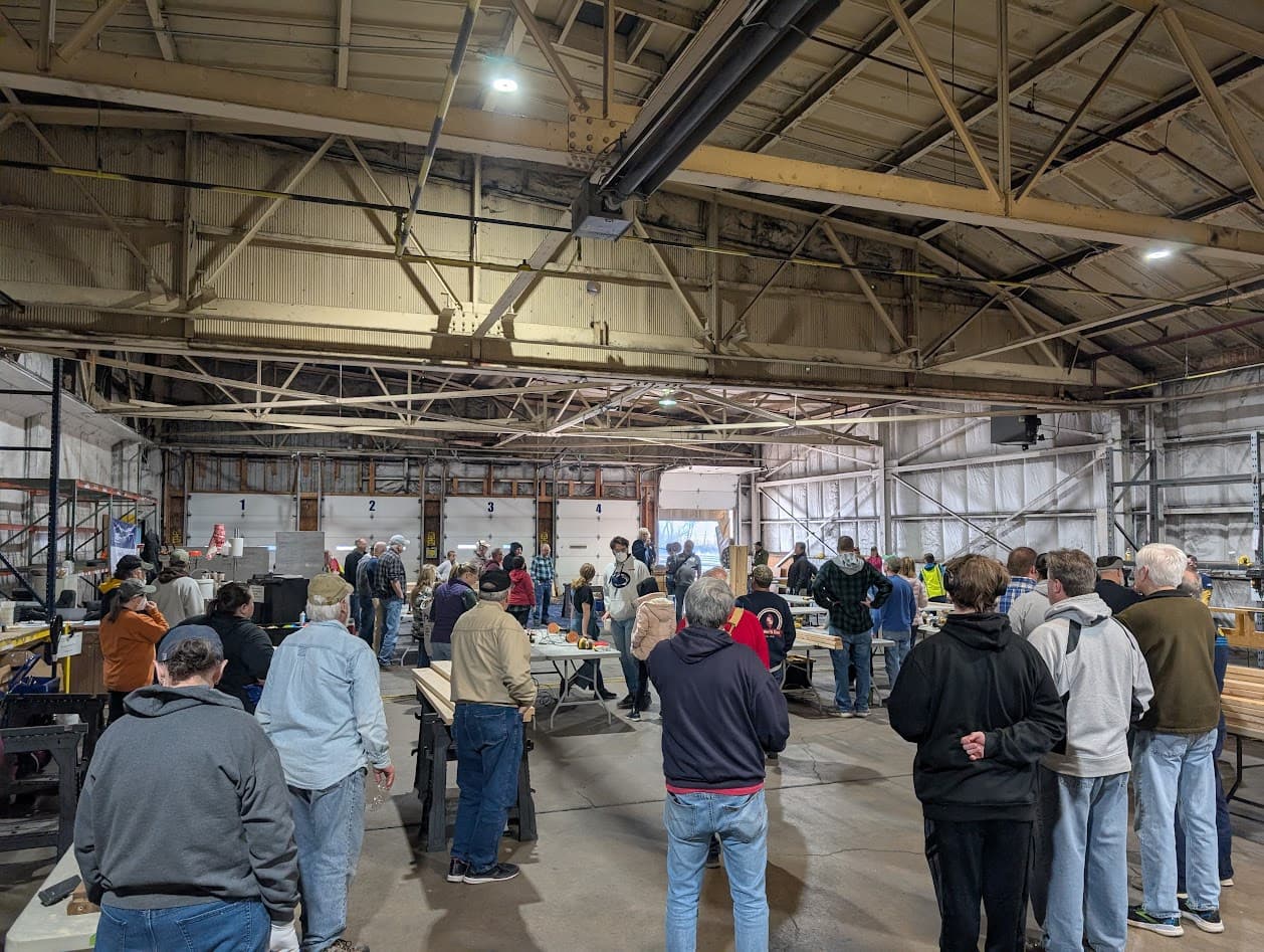 Community volunteers gathered for the pre-build safety and orientation briefing